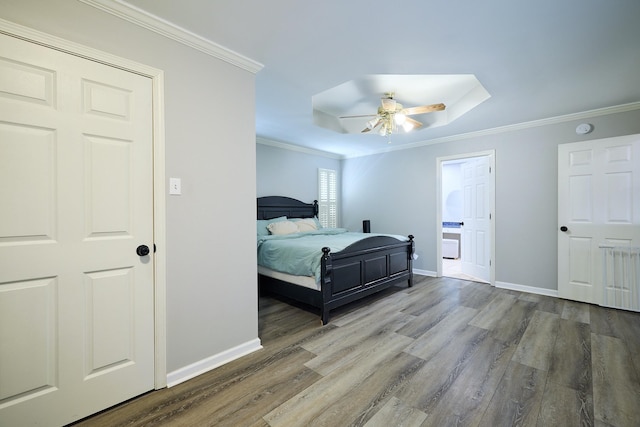 bedroom featuring crown molding, ceiling fan, and hardwood / wood-style floors