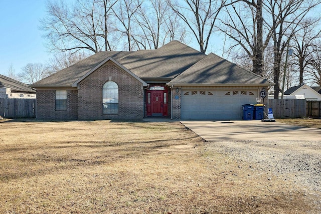 view of front of home featuring a garage and a front lawn