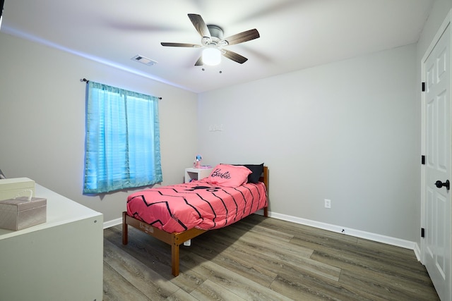 bedroom featuring wood-type flooring and ceiling fan