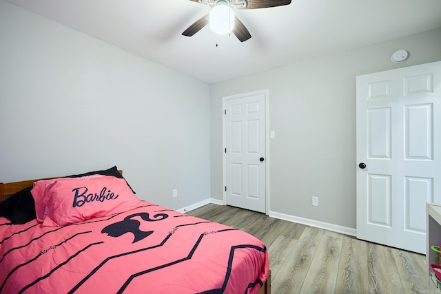 bedroom with ceiling fan and light wood-type flooring