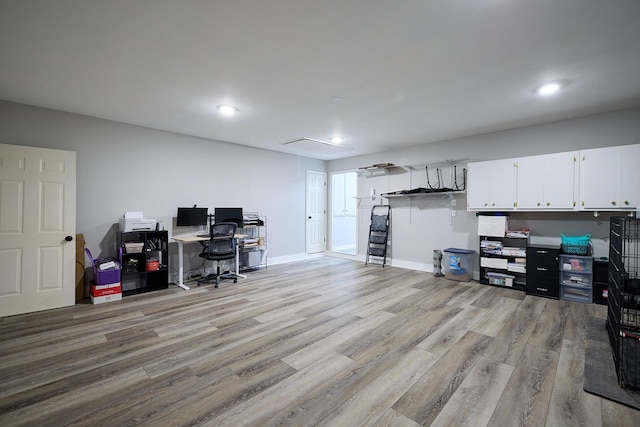 office with light wood-type flooring