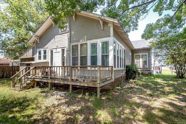 back of house featuring a wooden deck