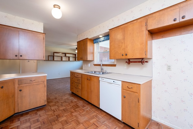 kitchen with dishwasher, sink, light parquet flooring, and ceiling fan