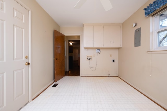 laundry area with ceiling fan, hookup for a washing machine, electric panel, cabinets, and hookup for an electric dryer