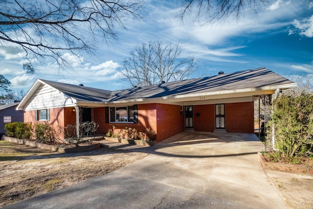 ranch-style home featuring a carport