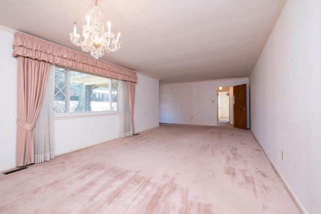 unfurnished room with an inviting chandelier, crown molding, and carpet floors