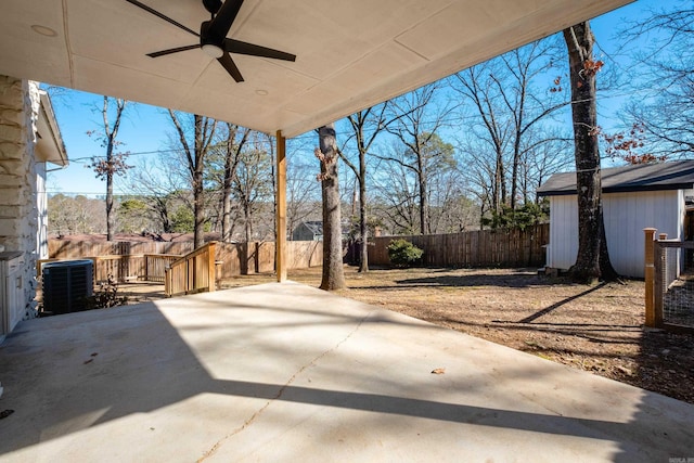 view of patio / terrace featuring a fenced backyard, cooling unit, and a ceiling fan