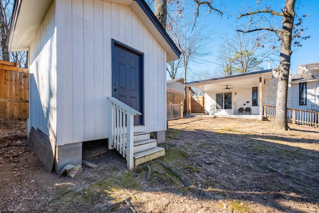 back of property featuring ceiling fan