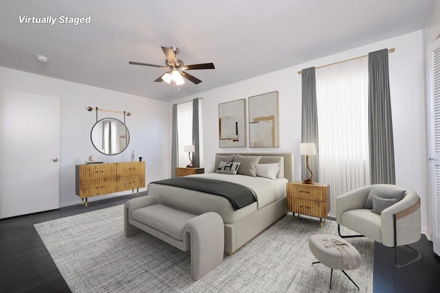 bedroom featuring wood finished floors and a ceiling fan