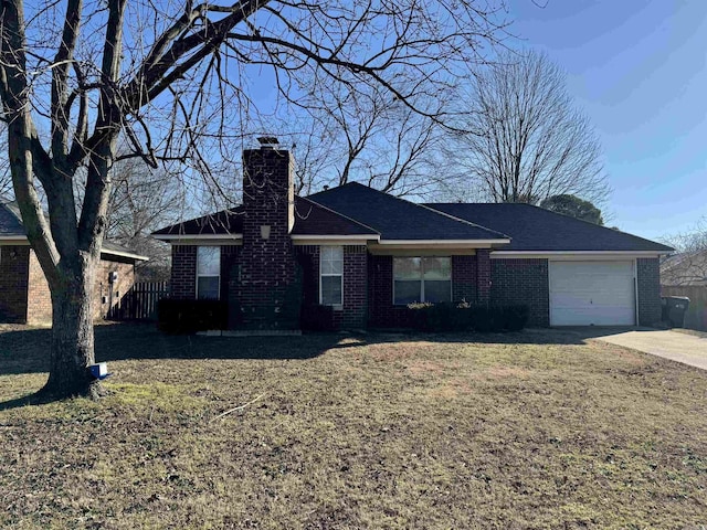 single story home with a garage and a front yard