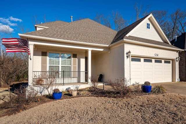 view of front of property with a garage and covered porch