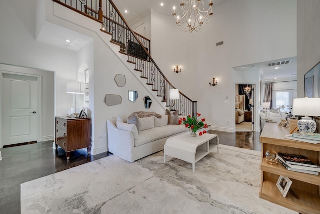 living room featuring a notable chandelier and a high ceiling