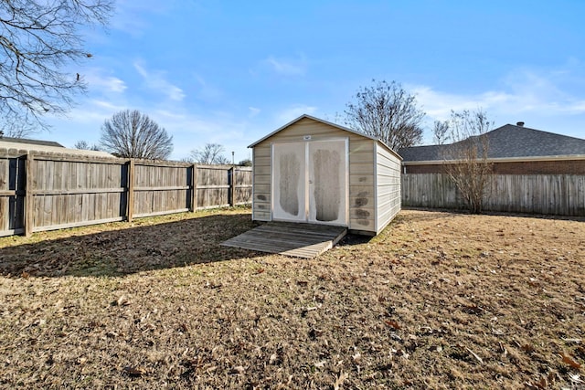 view of outbuilding featuring a yard