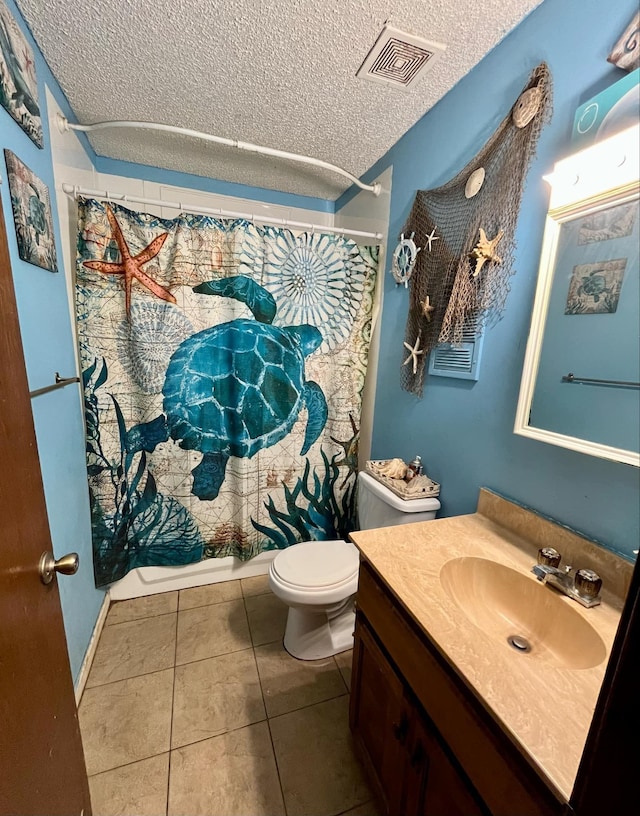 bathroom featuring walk in shower, toilet, a textured ceiling, vanity, and tile patterned flooring