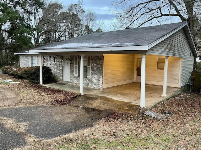 exterior space with a carport