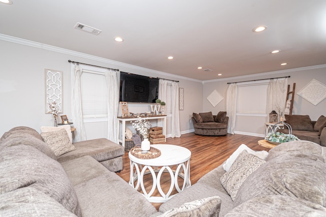 living room featuring hardwood / wood-style floors and ornamental molding