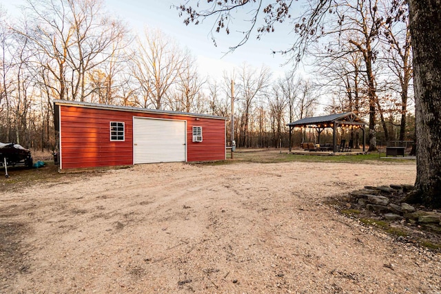 view of outdoor structure with a gazebo and a garage