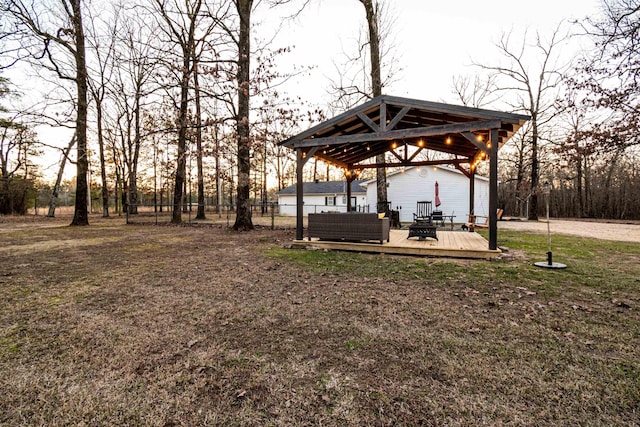 view of yard with a gazebo, outdoor lounge area, and a deck