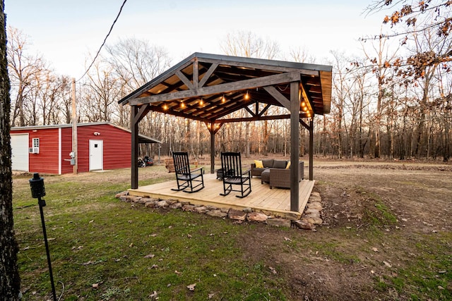 view of property's community with a gazebo, an outdoor structure, and a lawn