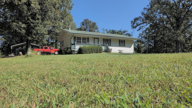 single story home featuring a porch and a carport