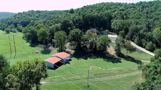 birds eye view of property with a rural view