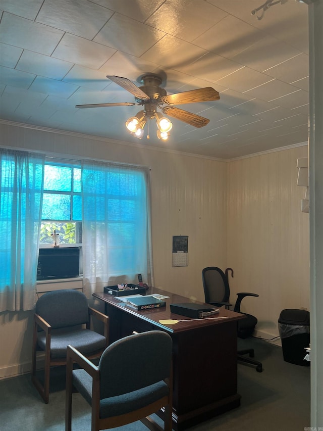 office space with crown molding, ceiling fan, and carpet