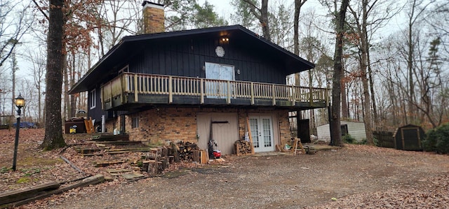 view of front of property with a deck and french doors