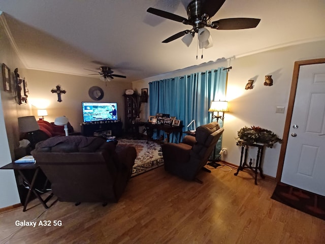 living room with ceiling fan, ornamental molding, and wood-type flooring