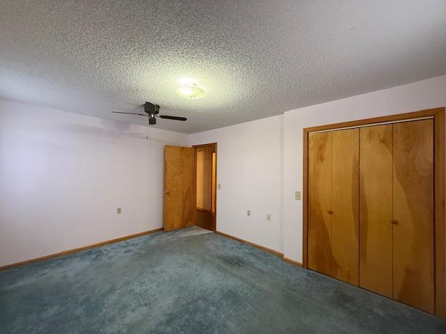 unfurnished bedroom featuring a textured ceiling, a closet, ceiling fan, and carpet