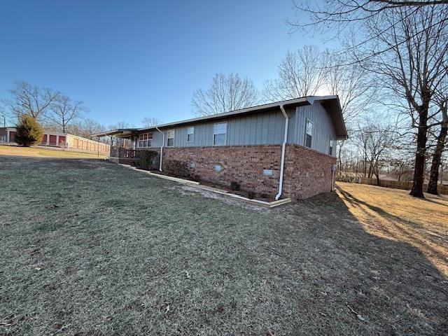 view of property exterior featuring a yard