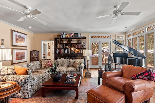 living room featuring french doors, ceiling fan, ornamental molding, and hardwood / wood-style flooring