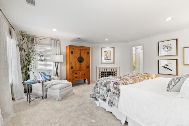 carpeted bedroom with ornamental molding