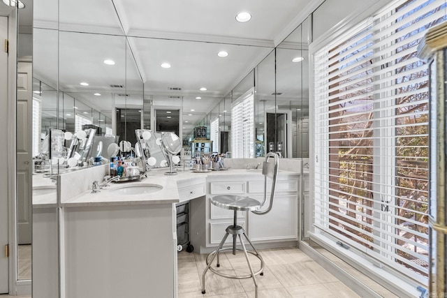 bathroom featuring vanity, crown molding, and tile patterned floors