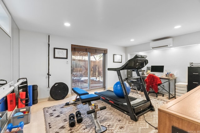 workout room with a wall mounted air conditioner