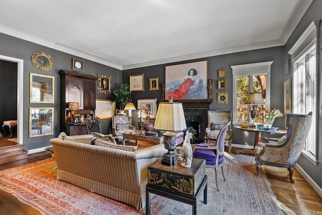 living room featuring crown molding, a high end fireplace, and hardwood / wood-style floors