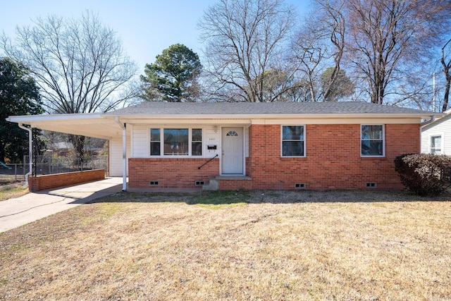 view of front facade with a front lawn and a carport