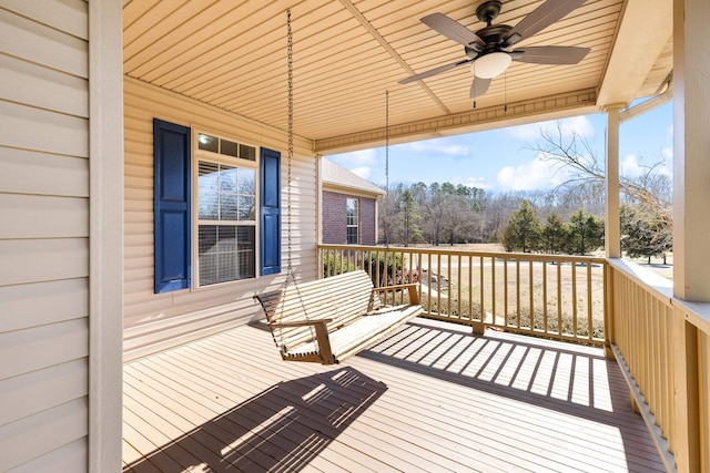 wooden deck with ceiling fan