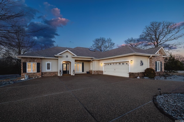 view of front of property with a garage