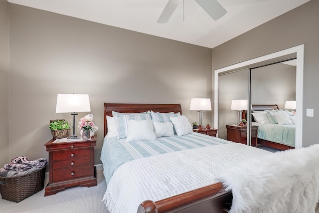 carpeted bedroom featuring a closet and ceiling fan