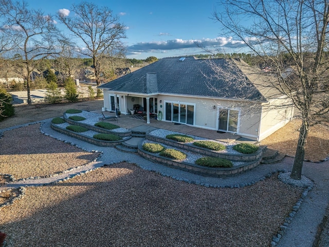 rear view of property with a patio area