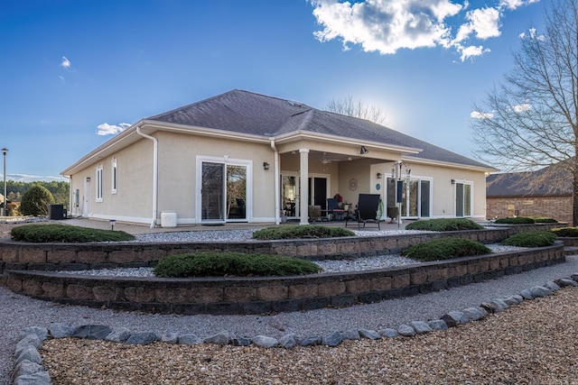 back of house with central AC unit and a patio area