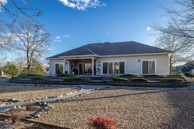 rear view of house with ceiling fan