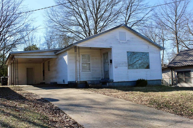 view of front of home featuring a carport