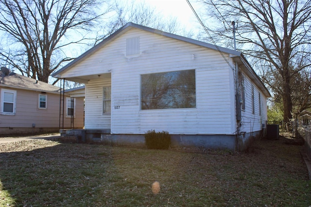 rear view of house featuring central air condition unit