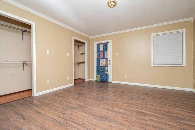 unfurnished bedroom with dark wood-type flooring and ornamental molding