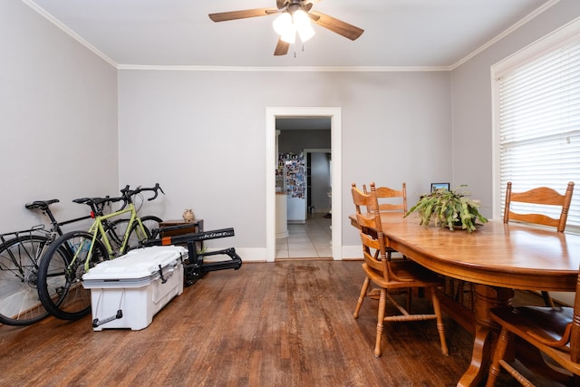 dining room with ceiling fan, ornamental molding, and wood-type flooring