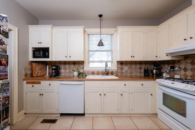 kitchen featuring light tile patterned flooring, sink, white cabinetry, hanging light fixtures, and white appliances