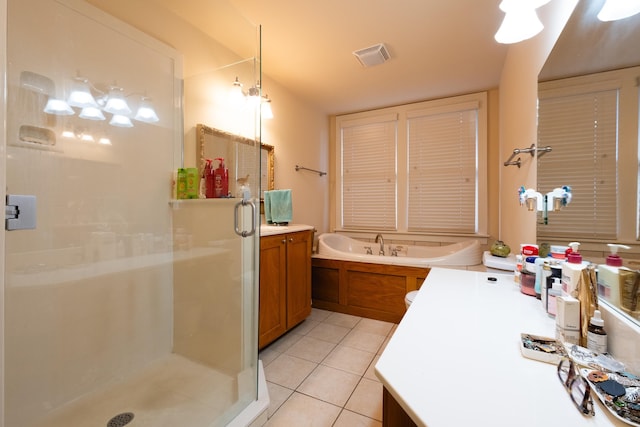 bathroom featuring shower with separate bathtub, tile patterned floors, and vanity