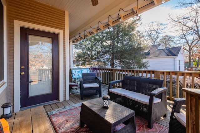 wooden deck featuring outdoor lounge area