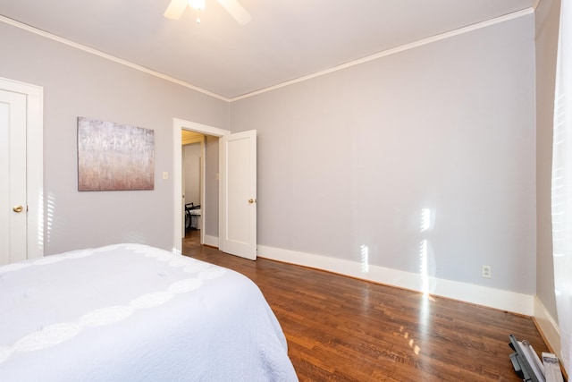 bedroom with crown molding, ceiling fan, and dark hardwood / wood-style flooring